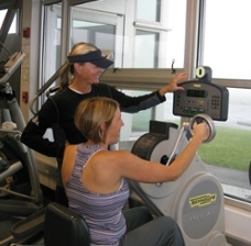 Fitness Trainer Kimball Barton assists a client