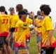 Men's Utimate Club participants high-five during spring 2023 USA Ultimate sectional tournament.